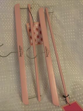 Juicy Couture pink wooden hangers, set of two, 15.5 inches long. New.